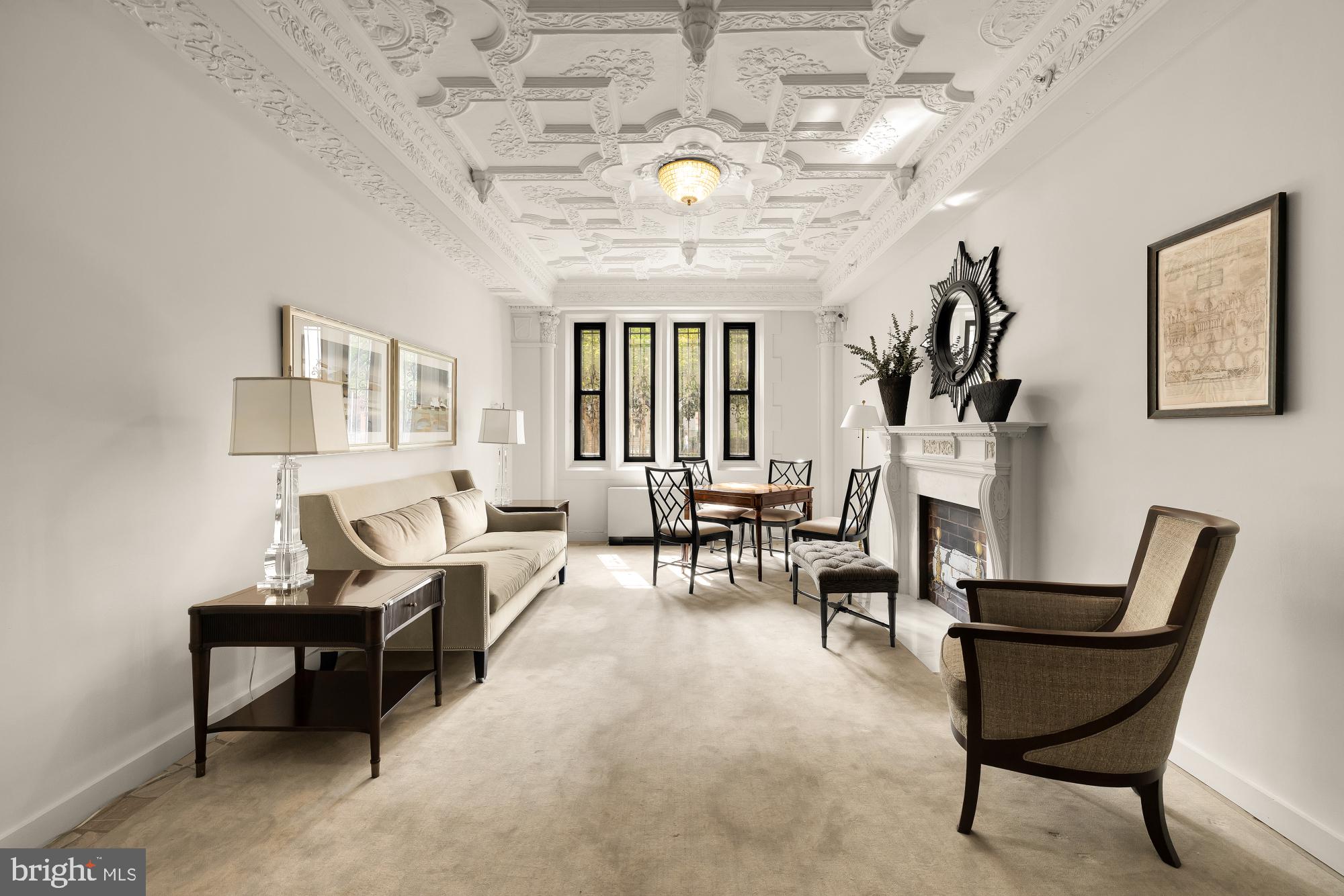 1701 16th Street Northwest, Unit 734 Washington, DC 20009 - Photo 26 of 30 a living room with furniture and a chandelier
