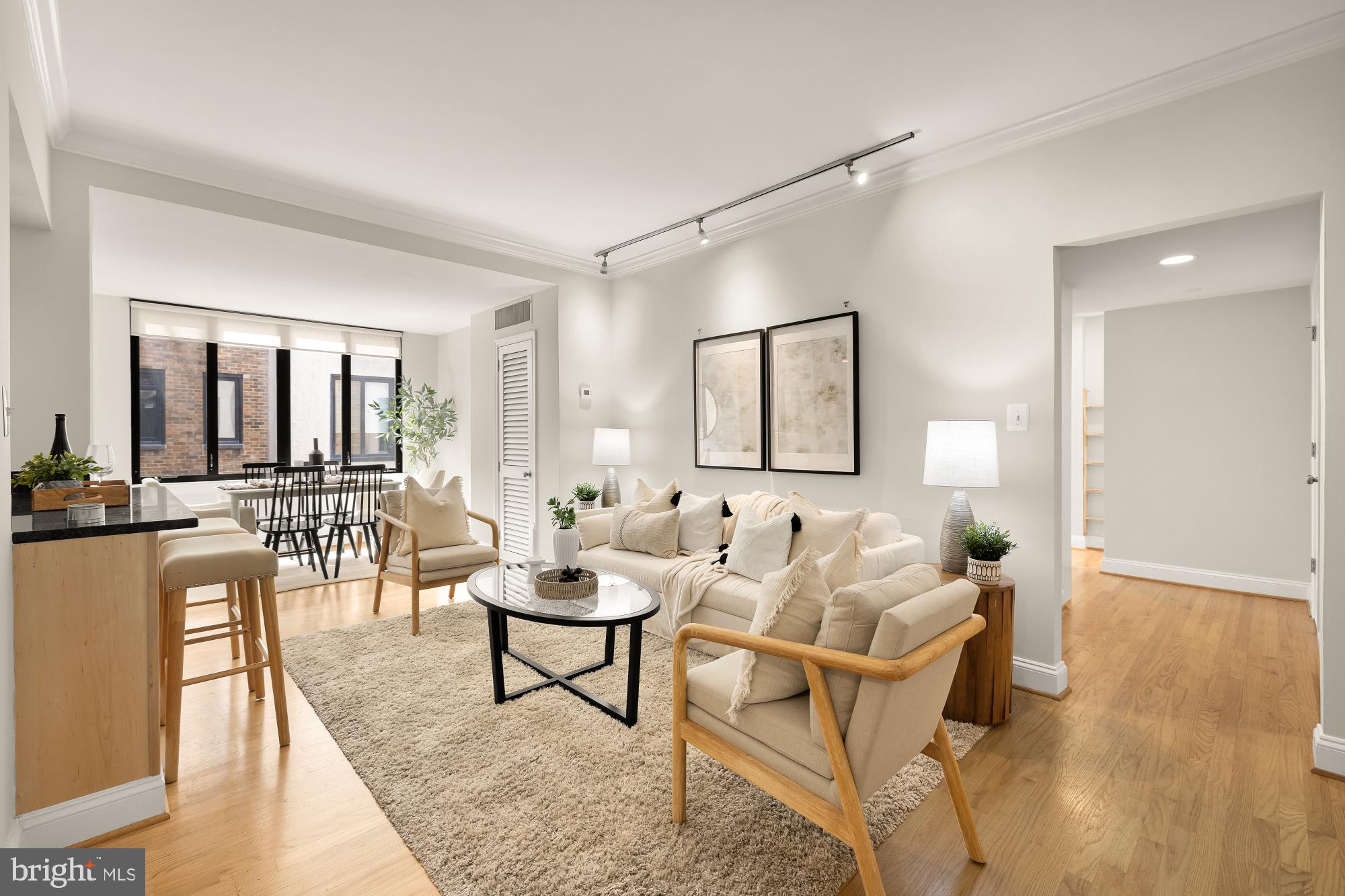 1701 16th Street Northwest, Unit 734 Washington, DC 20009 - Photo 3 of 30 a living room with furniture and a wooden floor