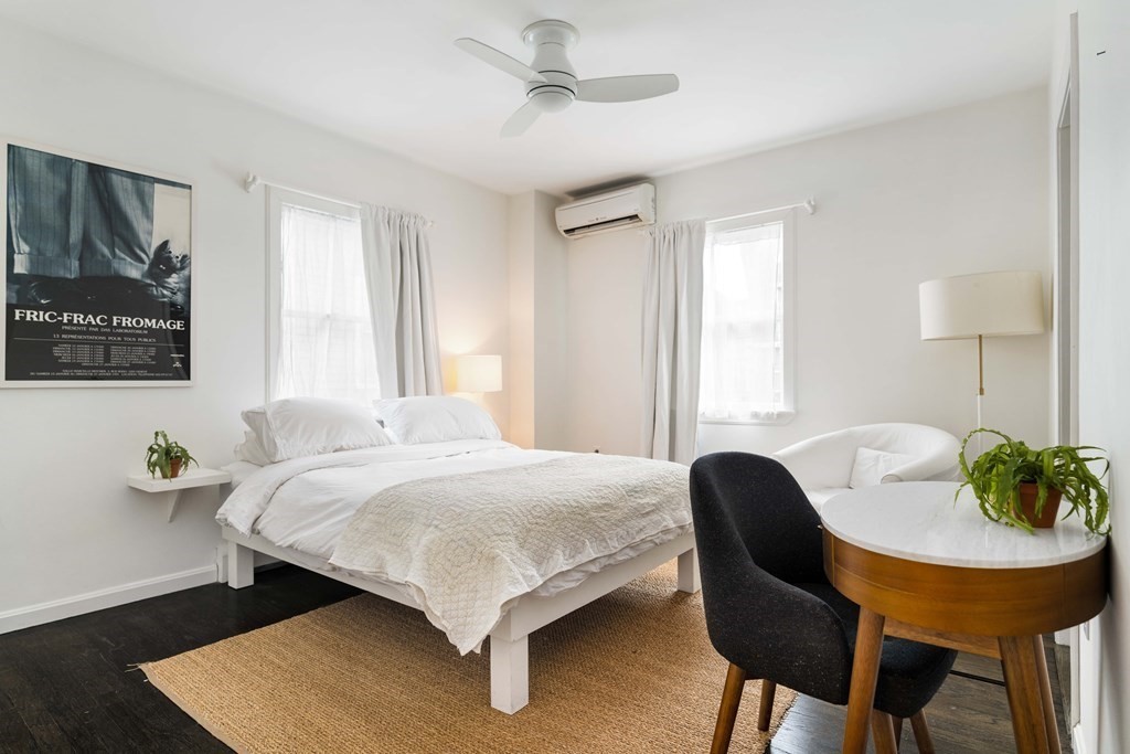 28 White Place Brookline, MA 02445 - Photo 11 of 18 a bedroom with a bed and a table