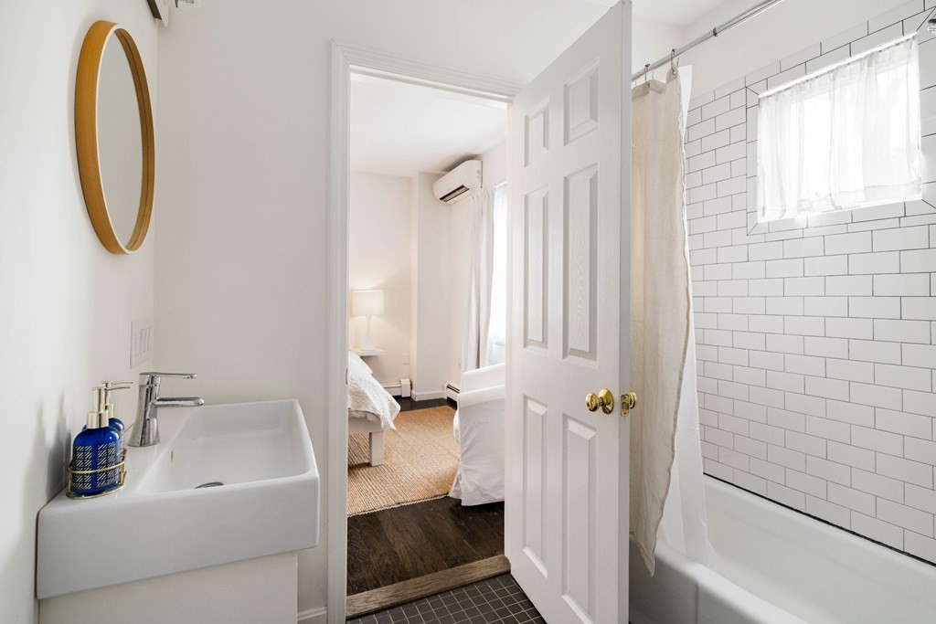 28 White Place Brookline, MA 02445 - Photo 12 of 18 a bathroom with a sink a toilet and a bathtub