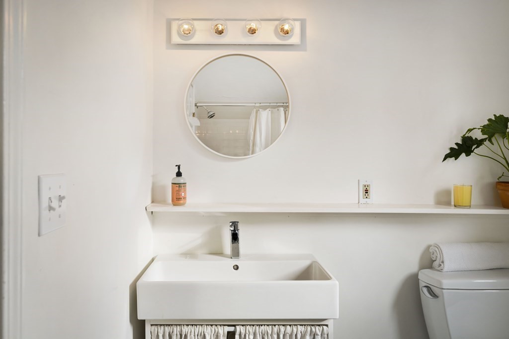 28 White Place Brookline, MA 02445 - Photo 17 of 18 a bathroom with a sink and a toilet