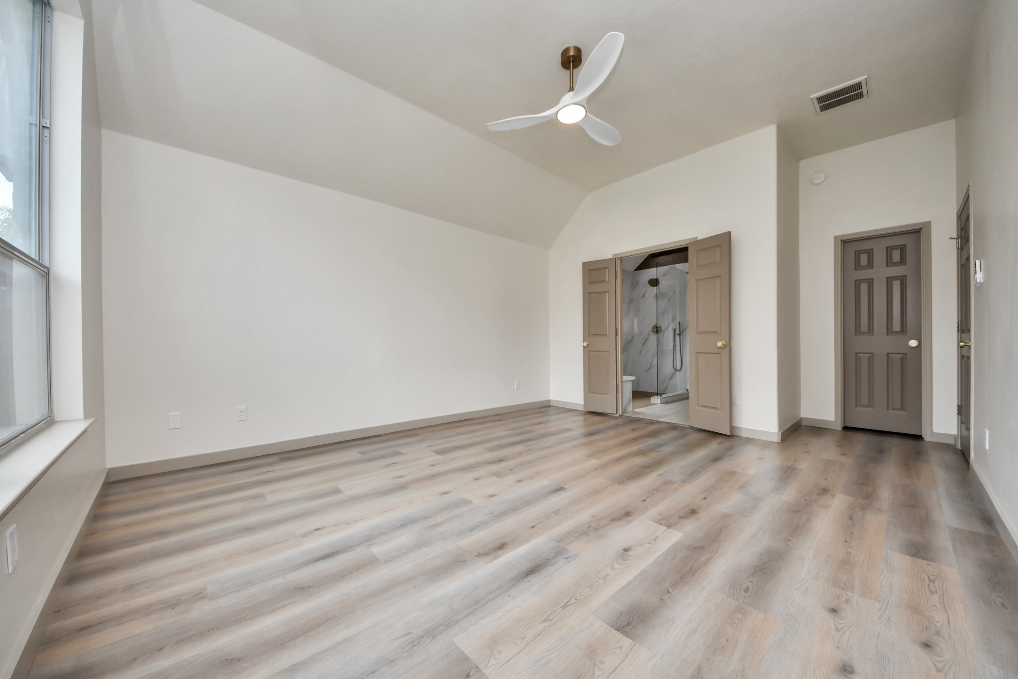 14423 Gadwall Court Houston, TX 77044 - Photo 31 of 42 wooden floor in an empty room with a window