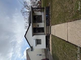 7801 Rutherford Street Detroit, MI 48228 - Photo 1 of 6 Bungalow-style house featuring a front lawn and covered porch