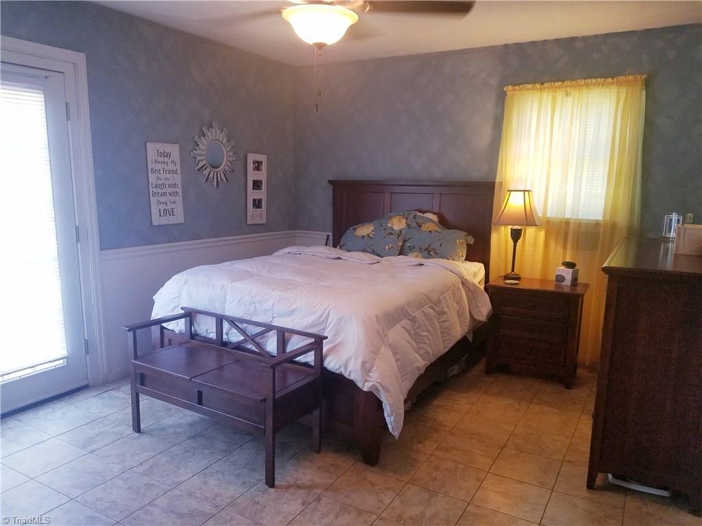 3240 Sourwood Ridge Road Lenoir, NC 28645 - Photo 16 of 25 Large master suite with 3 closets. French doors lead out to deck over looking the pool