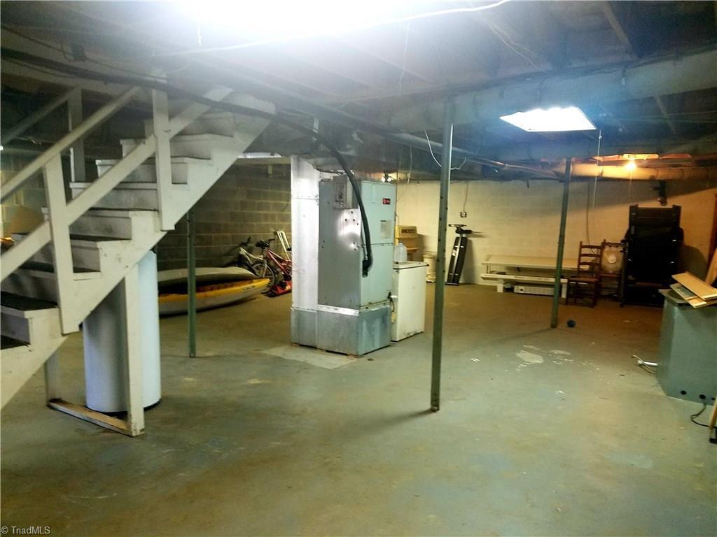 3240 Sourwood Ridge Road Lenoir, NC 28645 - Photo 23 of 25 Full unfinished basement great for storage and garage door