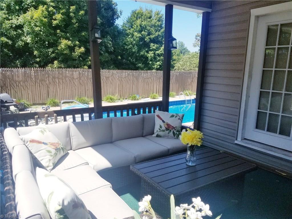 3240 Sourwood Ridge Road Lenoir, NC 28645 - Photo 5 of 25 Porch to relax with TV and pool view