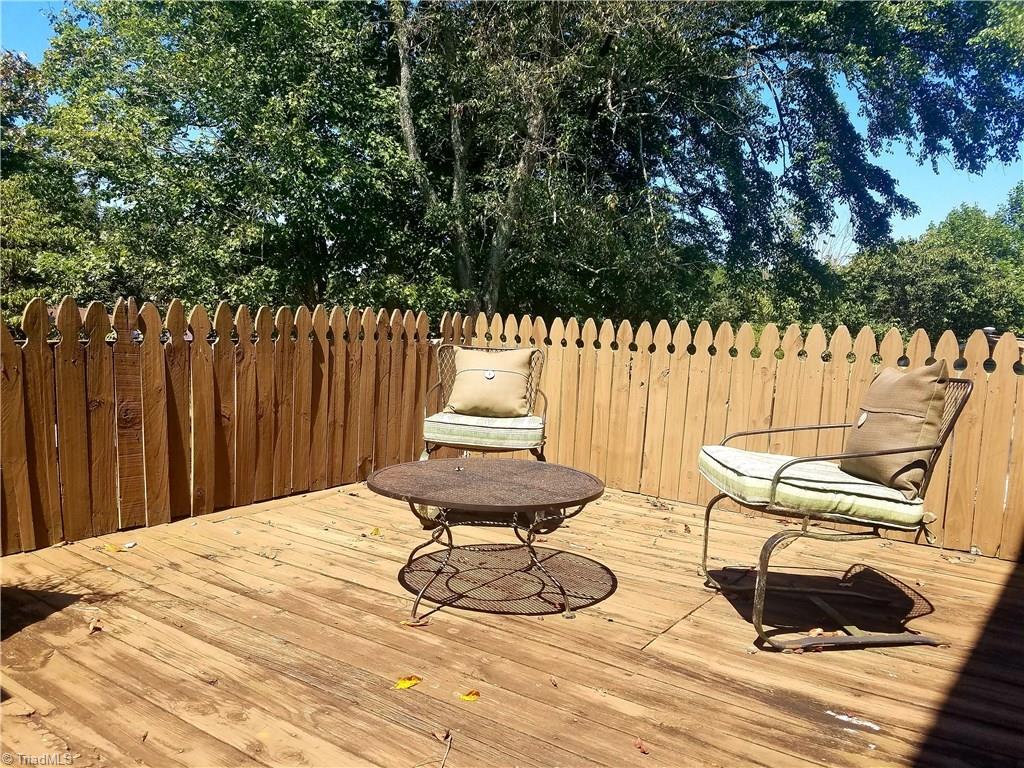 3240 Sourwood Ridge Road Lenoir, NC 28645 - Photo 7 of 25 Sun deck overlooking pool. Step out from master suite onto this area.