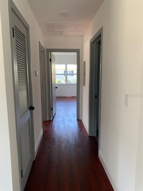 2237 Washington Road Mount Dora, FL 32757 - Photo 4 of 16 a view of a hallway with wooden floor