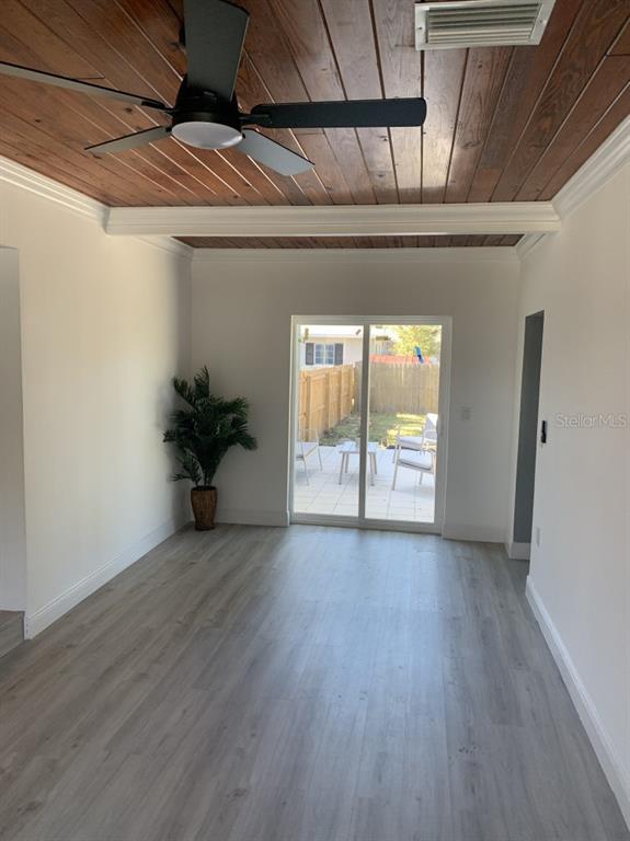 2237 Washington Road Mount Dora, FL 32757 - Photo 10 of 16 a view of an empty room with a window