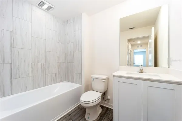 a bathroom with a toilet a sink and a bathtub