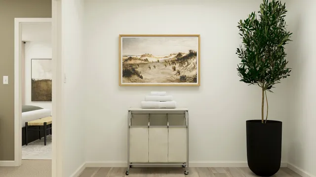 a view of a room with a potted plant and a ceiling fan