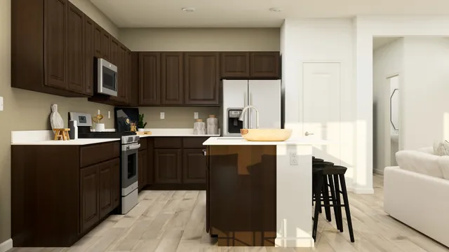 a kitchen with a sink a stove and refrigerator