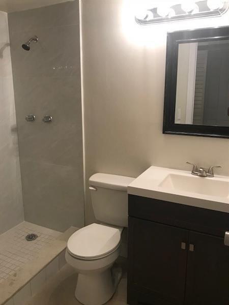 4216 Inverrary Boulevard, Unit 92A Lauderhill, FL 33319 - Photo 10 of 11 a bathroom with a sink and a toilet
