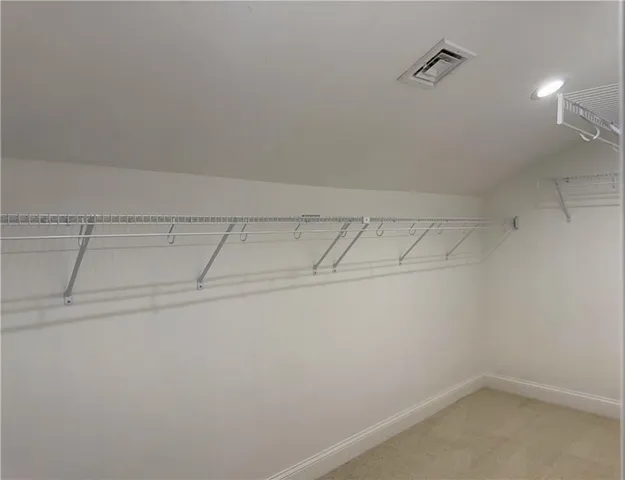a view of a room with racks on the wall