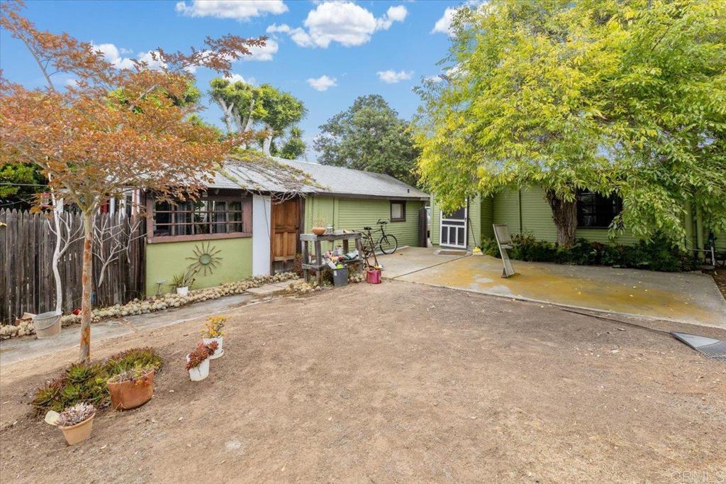 334 Date Avenue Carlsbad, CA 92008 - Photo 7 of 26 a view of a patio with table and chairs under an umbrella