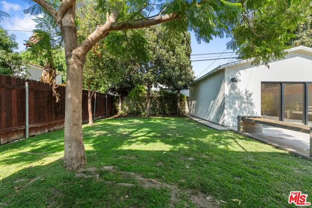 swimming pool view with a seating space