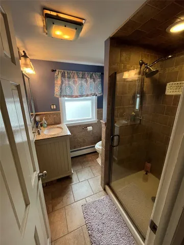 an outdoor living room with furniture and a large window