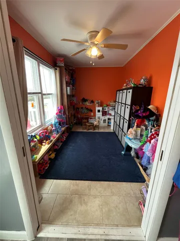 a room with gym equipment and a large window