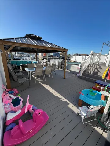 a view of a house with wooden deck