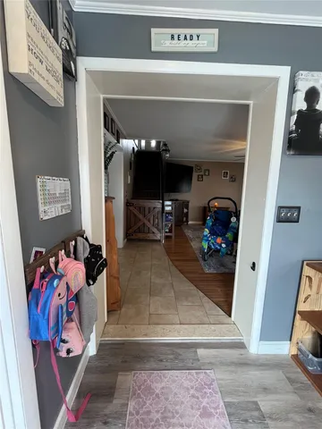 a view of a hallway with washer and dryer