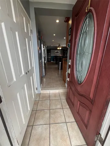 a view of a refrigerator in a kitchen