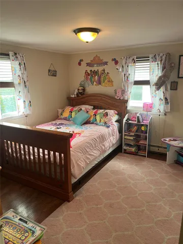 a bed room with a bed and a flat screen tv