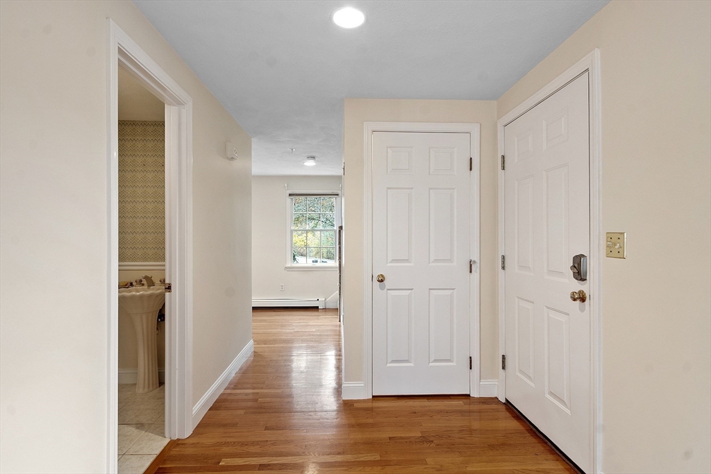 28 Partridge Lane, Unit 28 Lynnfield, MA 01940 - Photo 16 of 41 a view of a hallway with wooden floor