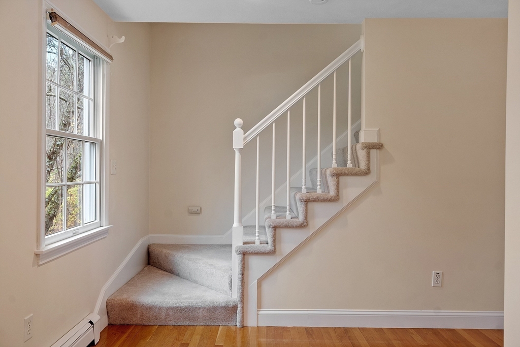 28 Partridge Lane, Unit 28 Lynnfield, MA 01940 - Photo 17 of 41 a view of entryway and hall with wooden floor