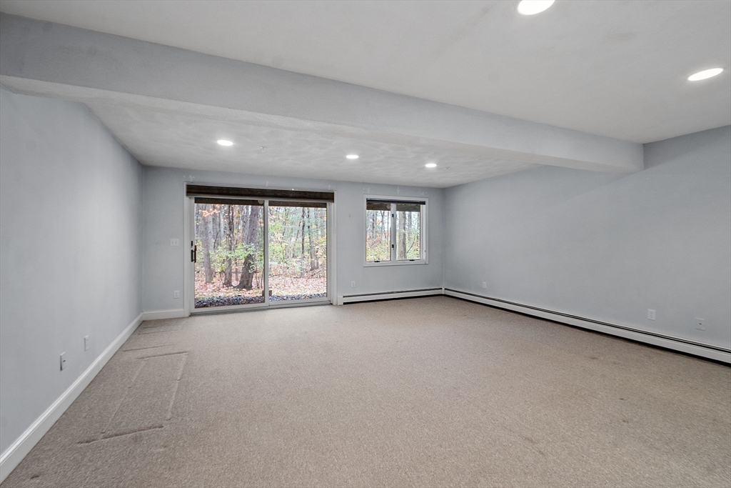 28 Partridge Lane, Unit 28 Lynnfield, MA 01940 - Photo 20 of 41 a view of an empty room with a window
