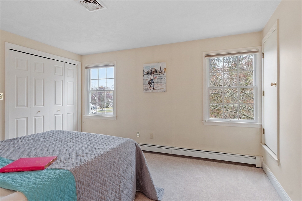 28 Partridge Lane, Unit 28 Lynnfield, MA 01940 - Photo 21 of 41 a bedroom with a bed and a window