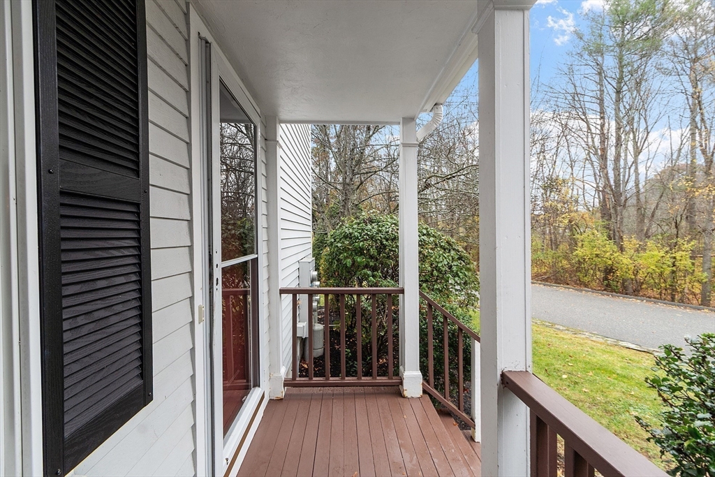 28 Partridge Lane, Unit 28 Lynnfield, MA 01940 - Photo 27 of 41 a view of a balcony with wooden floor and outdoor space