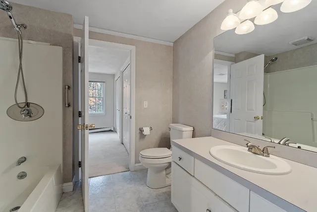 a bathroom with a sink a mirror and a shower