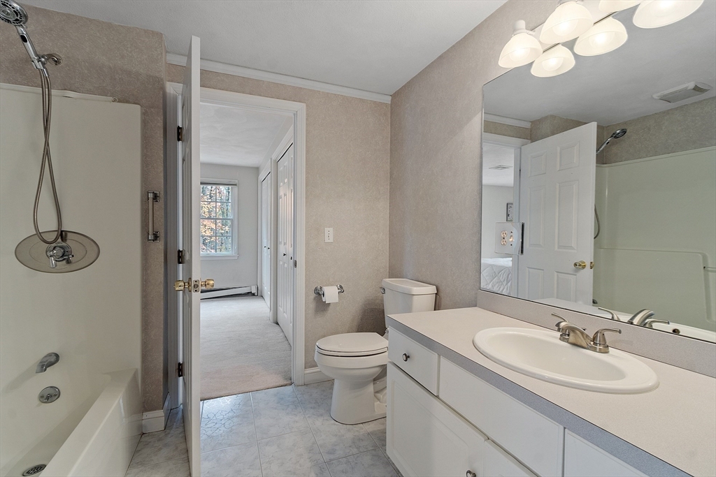 28 Partridge Lane, Unit 28 Lynnfield, MA 01940 - Photo 30 of 41 a bathroom with a sink a toilet and shower