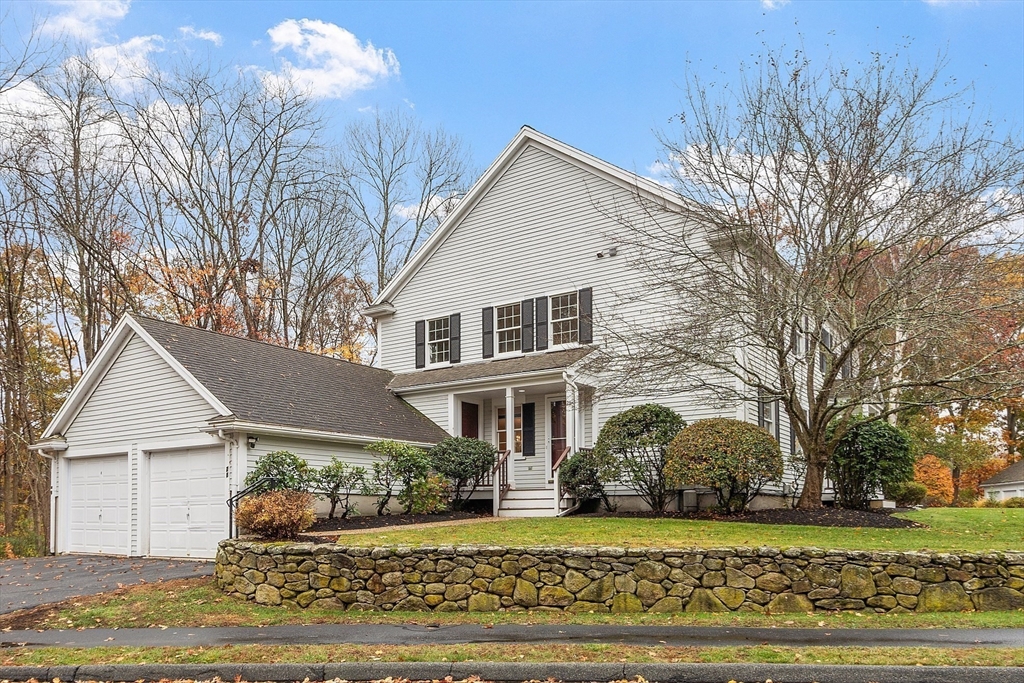 28 Partridge Lane, Unit 28 Lynnfield, MA 01940 - Photo 39 of 41 a front view of a house with a garden