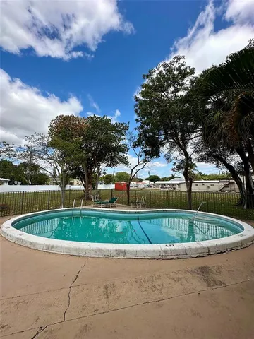 a view of a fountain in front of a house