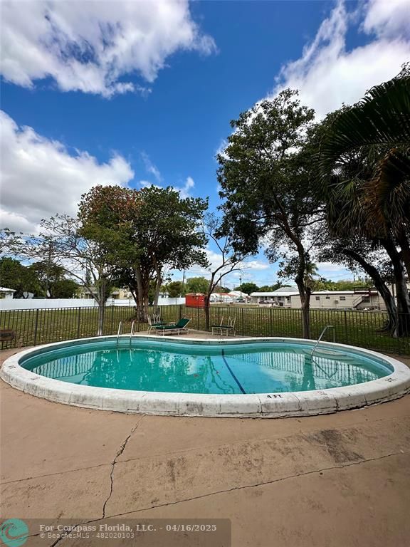 a view of a fountain in front of a house