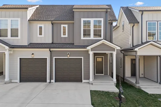 a front view of a house with a garage