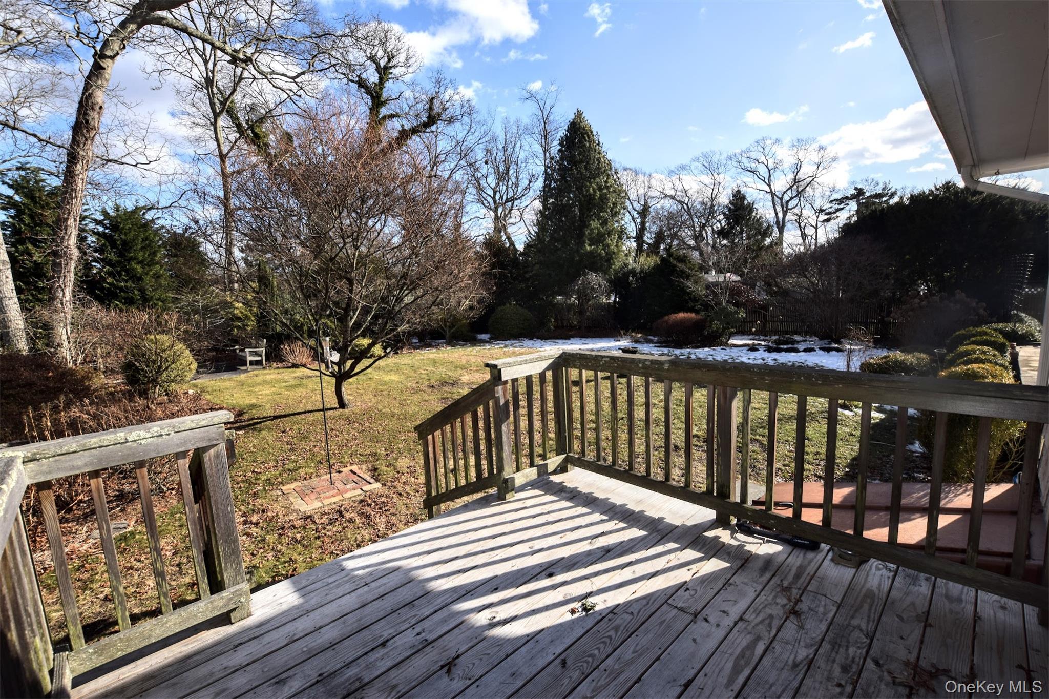 41 Country Club Road Bellport, NY 11713 - Photo 2 of 18 Wooden terrace featuring a yard