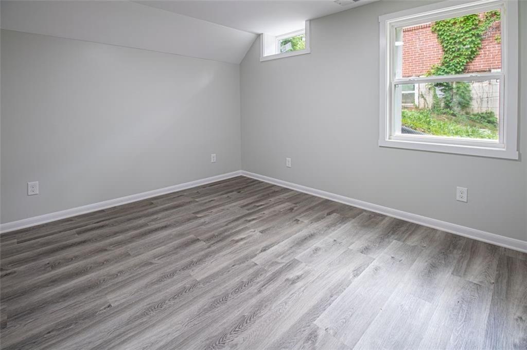 3699 Larkspur Terrace Decatur, GA 30032 - Photo 14 of 29 a view of room with window and wooden floor