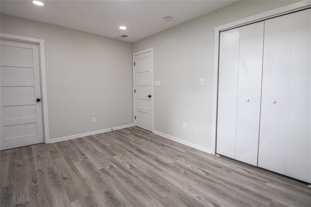 3699 Larkspur Terrace Decatur, GA 30032 - Photo 28 of 29 a view of an empty room with wooden floor