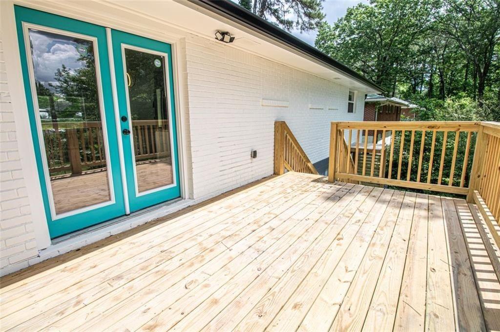 3699 Larkspur Terrace Decatur, GA 30032 - Photo 10 of 29 a view of a balcony with wooden floor and fence