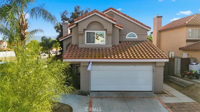 a front view of a house with a garage
