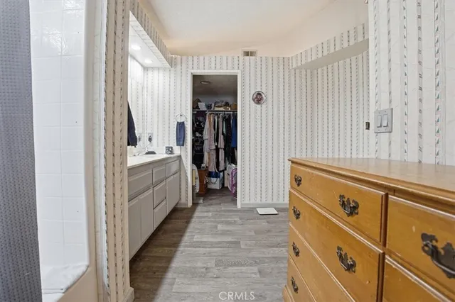 a bathroom with a sink a mirror and a bathtub