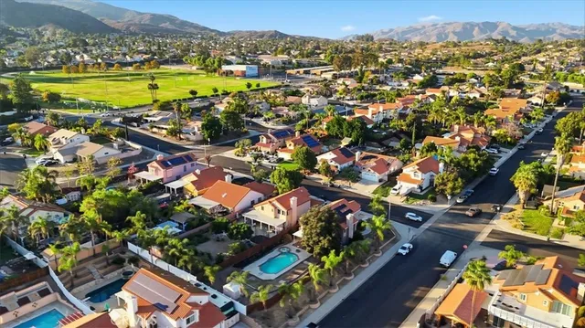 an aerial view of a houses with a lake view