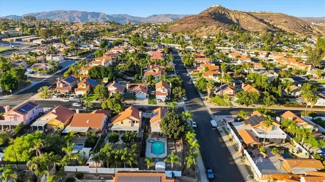 an aerial view of residential houses with outdoor space