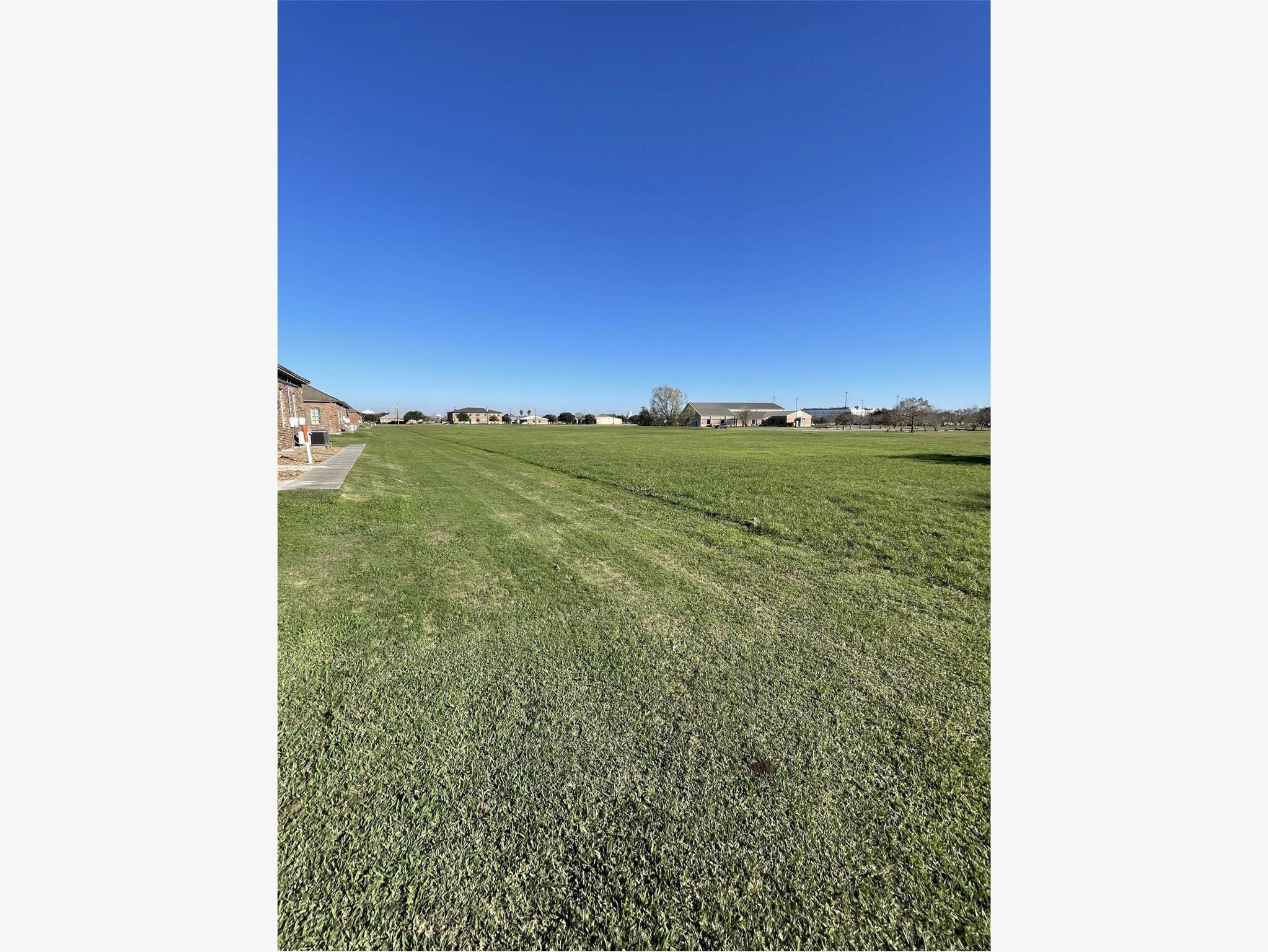0 Lake Road Lake Jackson, TX 77566 - Photo 14 of 23 a view of a green field