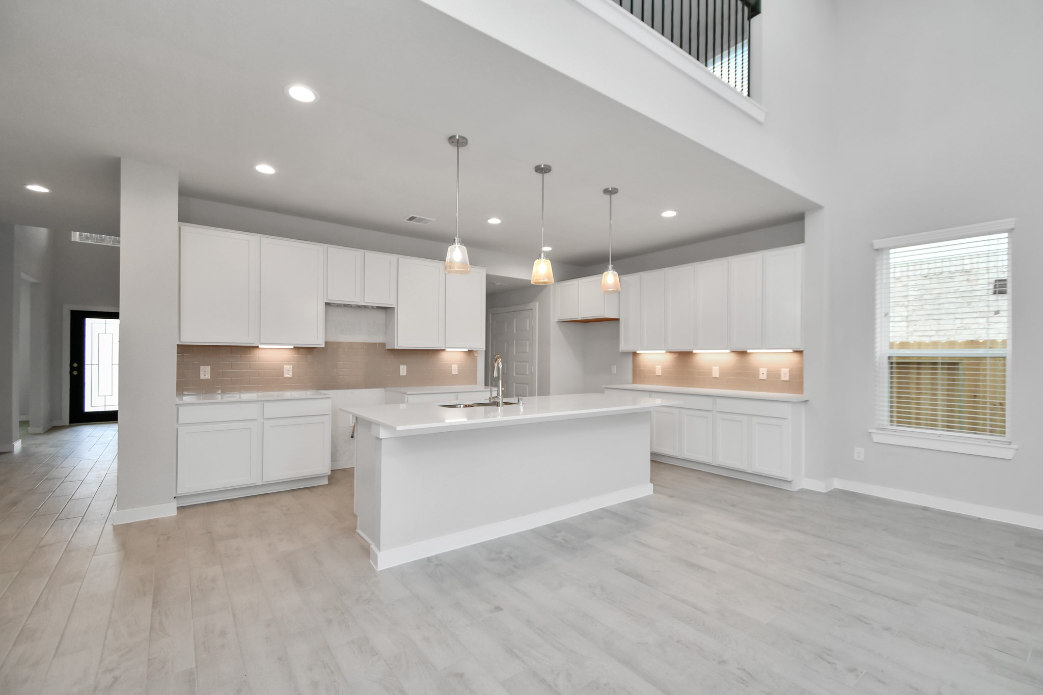 15111 Statice Trail Houston, TX 77044 - Photo 15 of 35 Beautiful bright kitchen space making meal prep enjoyable. Sample photo of completed home with similar floor plan. Actual colors and selections may vary.