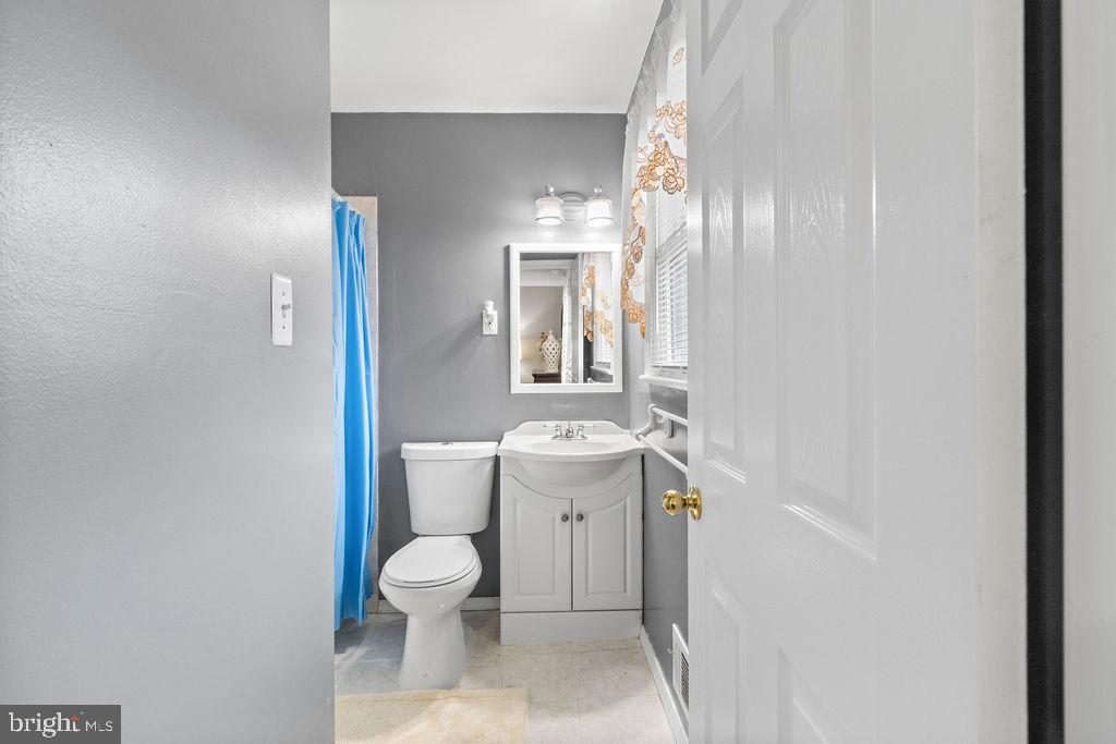 607 Valley Brook Drive Silver Spring, MD 20904 - Photo 22 of 67 a bathroom with a sink toilet and shower
