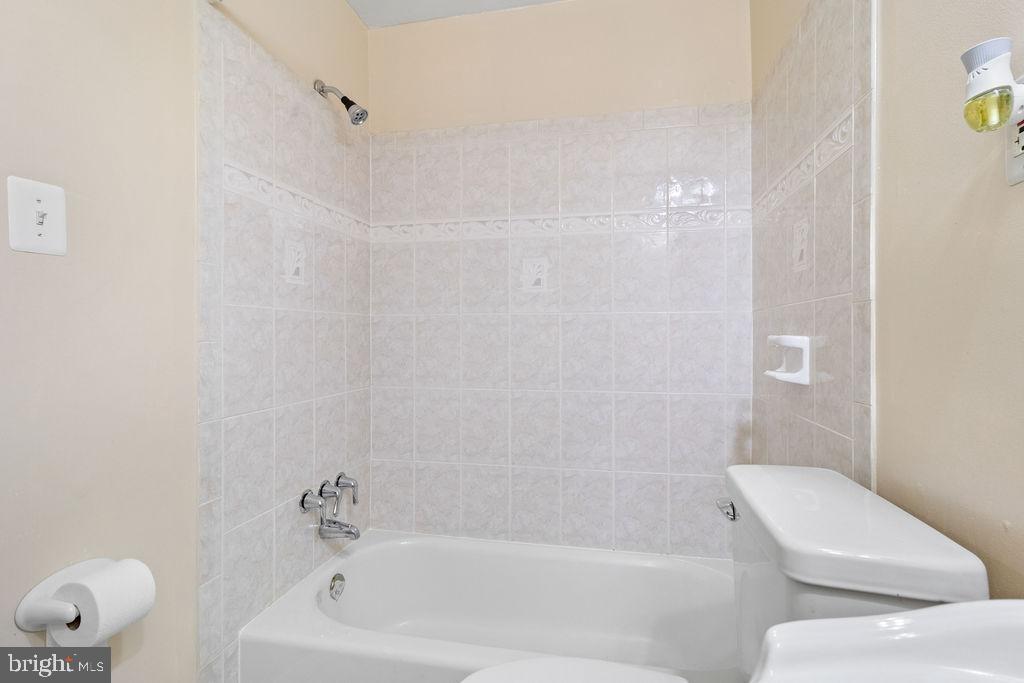 607 Valley Brook Drive Silver Spring, MD 20904 - Photo 25 of 67 a bathroom with a bathtub and shower