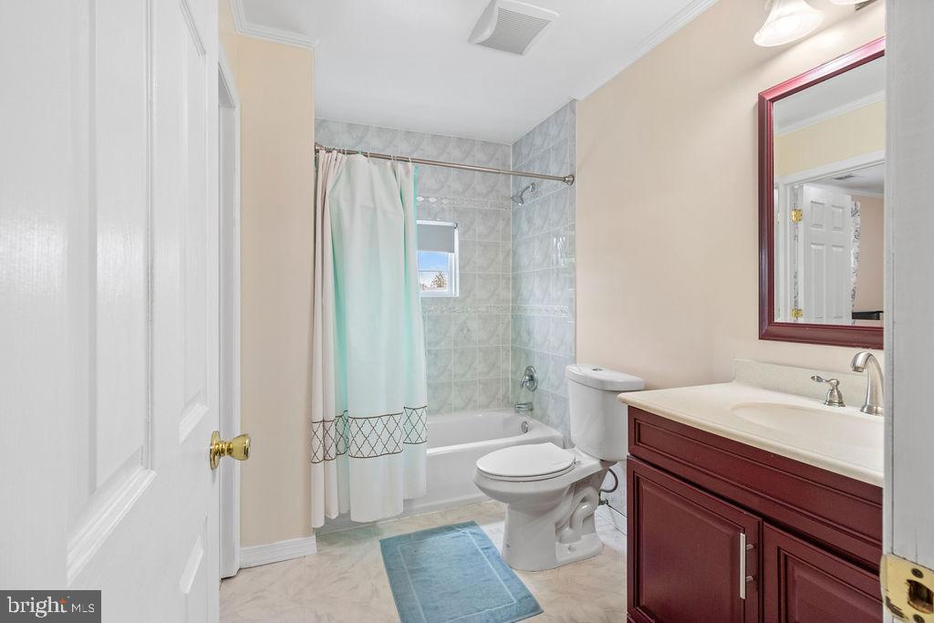 607 Valley Brook Drive Silver Spring, MD 20904 - Photo 30 of 67 a bathroom with a sink a toilet and shower